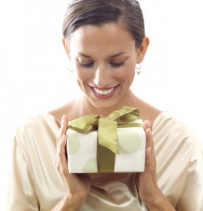 Smiling woman holding a gift