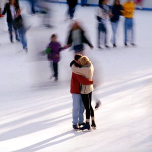 Couple hugging while ice skating