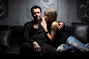 Man on couch with arm around girl