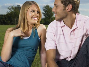 Couple enjoying one another on the lawn