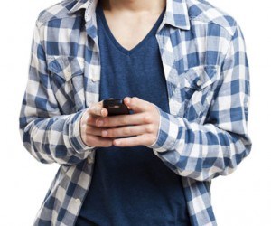 Person in blue checkered shirt, texting