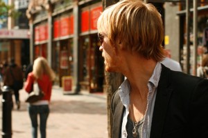 Man watching woman walk away