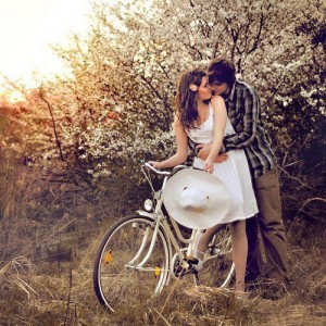 Couple on bike kissing