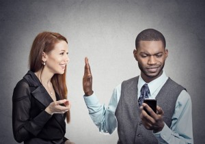 Woman being ignored by cellphone man