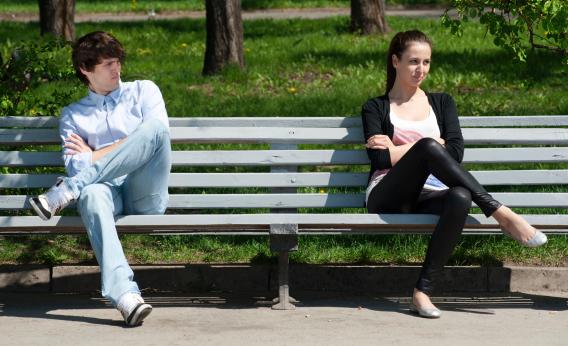 Couple sitting far apart