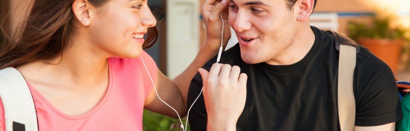 guy and girl listen to music together