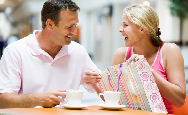 Couple laughing over coffee