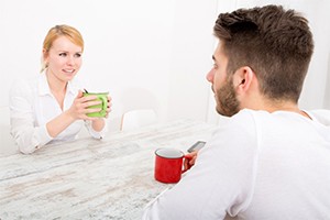 Couple sitting at table talking