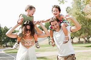 Couple playing with two young children