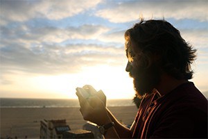 Man texting while out on walk.