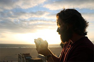 Man texting while out on walk.