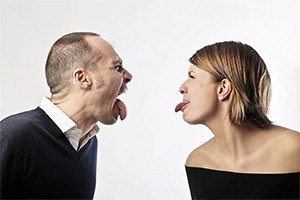 Couple making nasty faces at each other.
