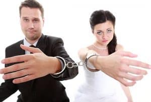 unhappy bride and groom cuffed