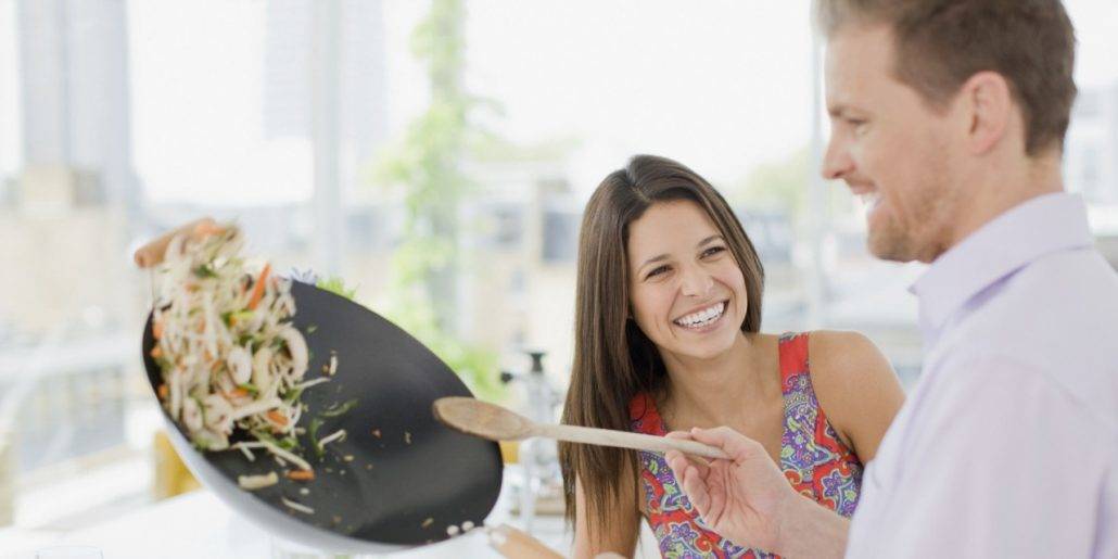 Man cooking girlfriend dinner