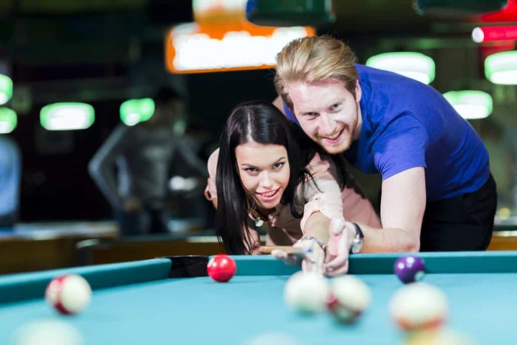 couple playing pool on date