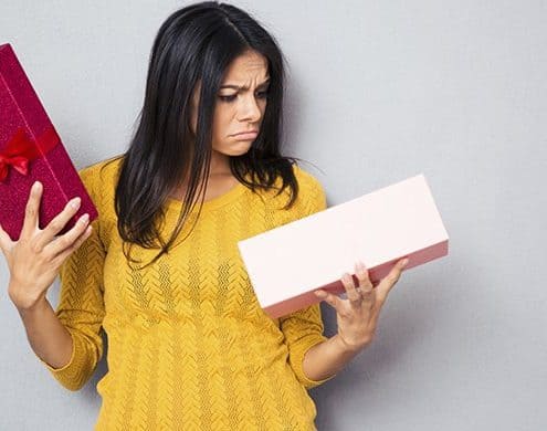 unhappy woman holding box