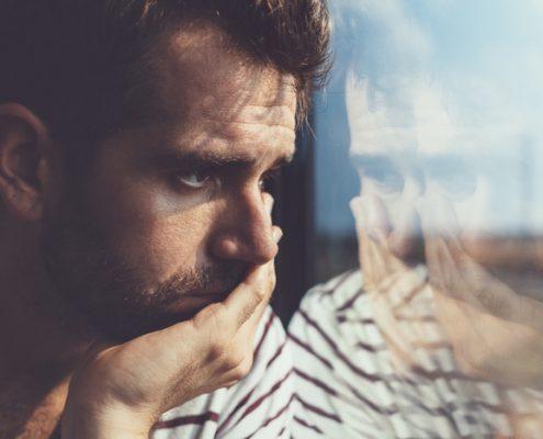 sad man looking out