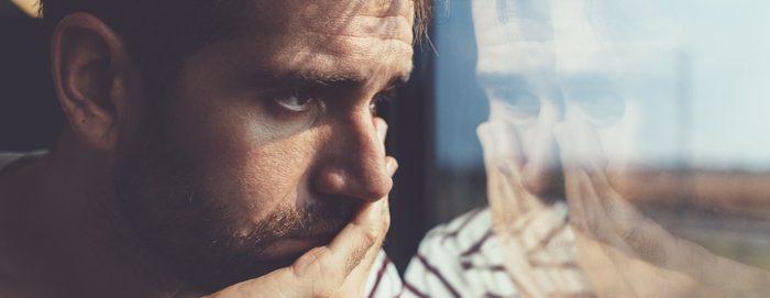 sad man looking out