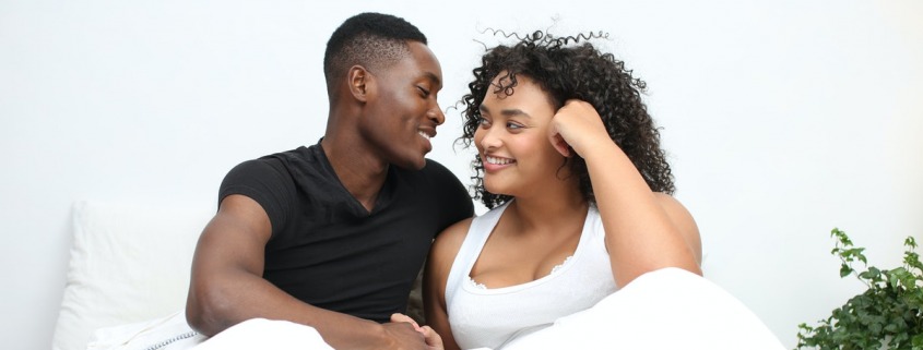 couple-in-bed-together-smiling