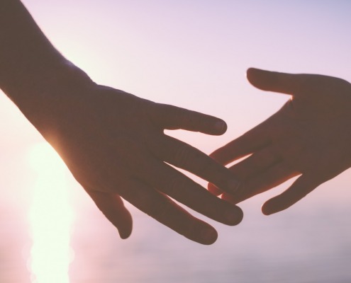 hands-touching-sunset
