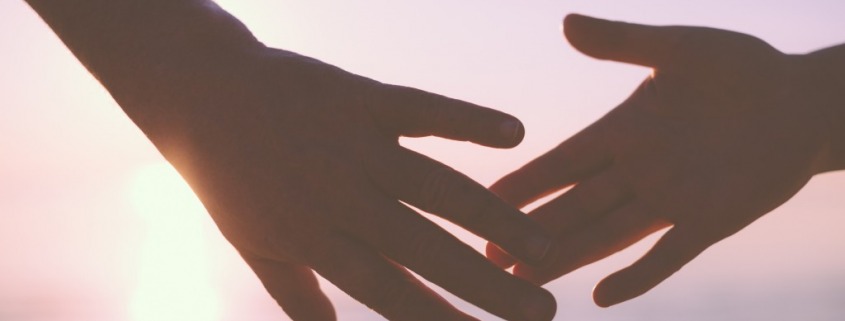 hands-touching-sunset