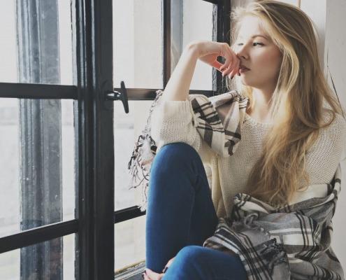 woman-thinking-in-window