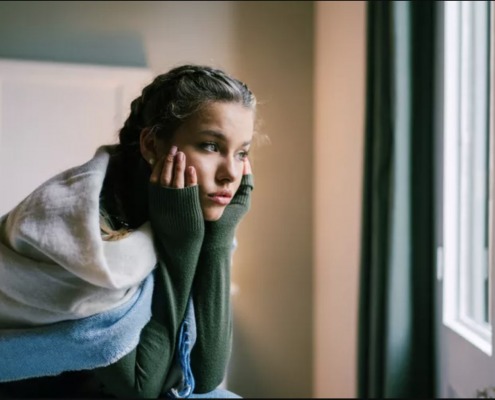 woman-crying-by-window