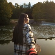 woman-holding-hand-and-looking-away
