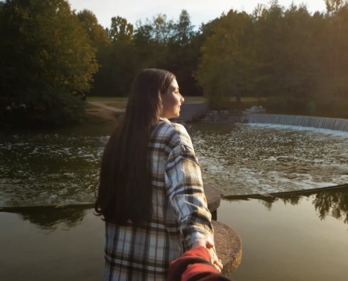 woman-holding-hand-and-looking-away
